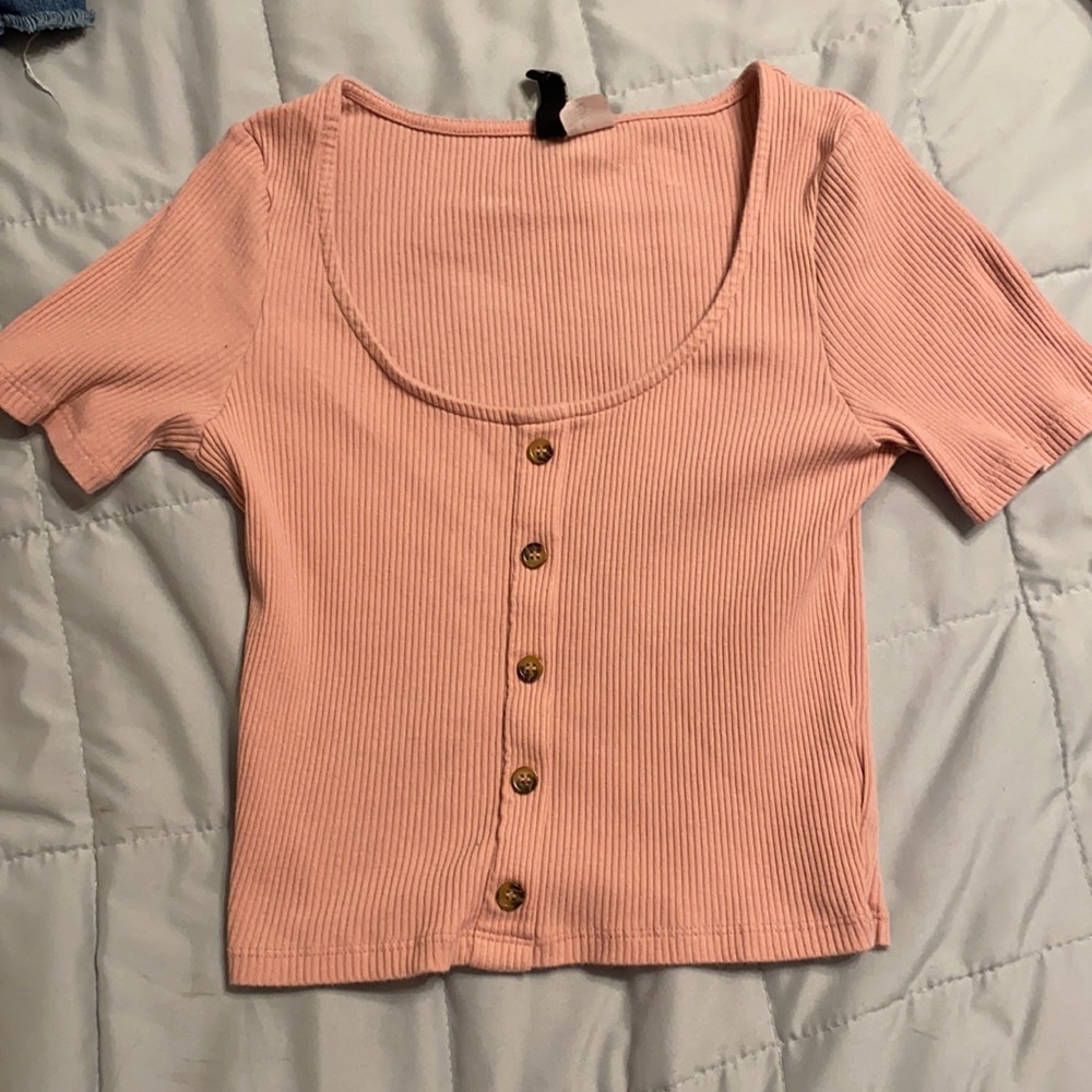 cropped shirt with buttons down the middle.